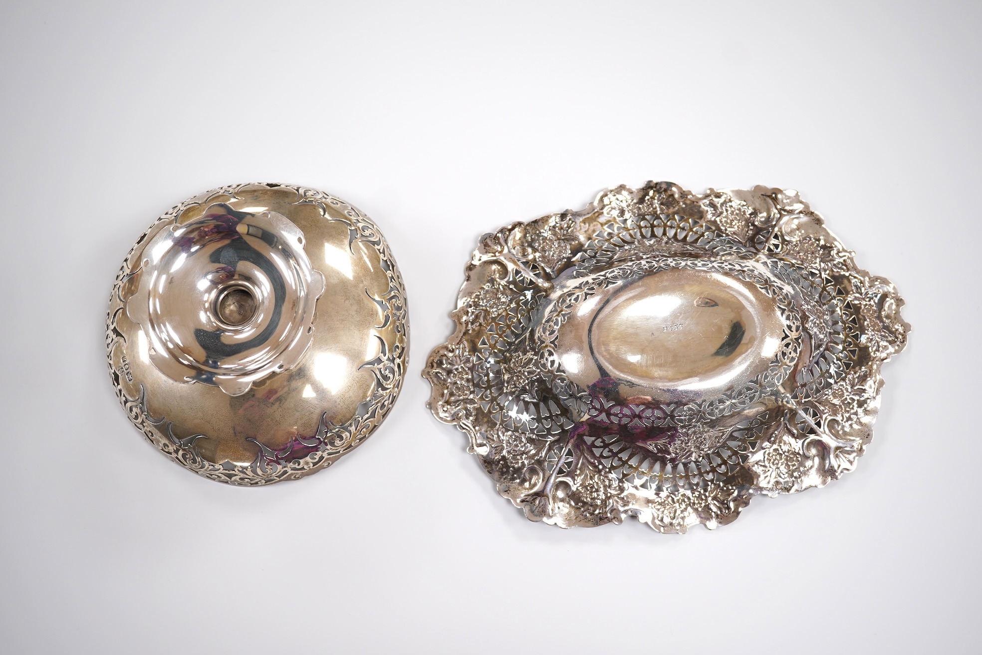 A late Victorian repousse silver oval bonbon dish, Martin, Hall & Co, Sheffield, 1895, length 20.8cm, together with an Elizabeth II pieced silver pedestal bonbon dish by Asprey & Co Ltd, London, 1965, 10.8oz.